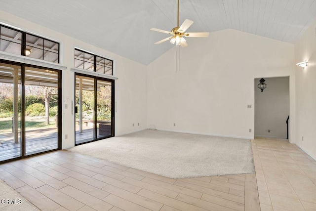 spare room featuring high vaulted ceiling, ceiling fan, and light hardwood / wood-style floors