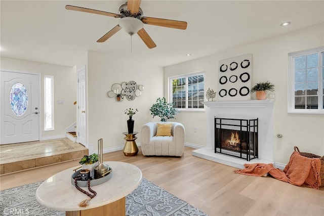 interior space with light wood-type flooring and ceiling fan