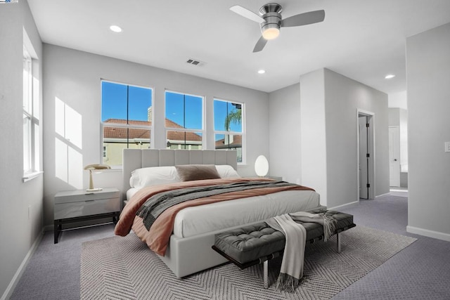 bedroom with ceiling fan and carpet floors