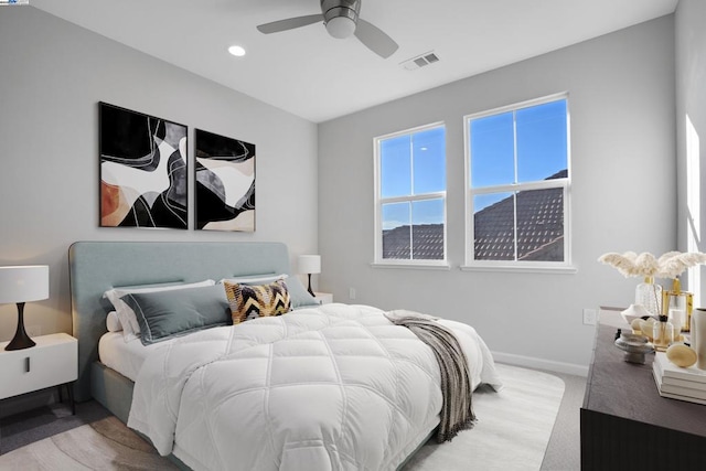 carpeted bedroom with ceiling fan