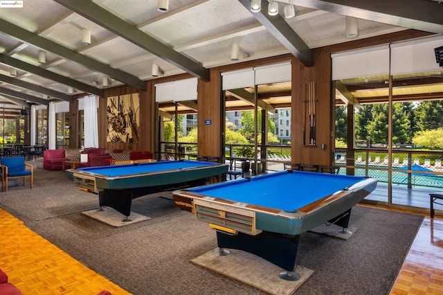 playroom featuring pool table, parquet floors, a healthy amount of sunlight, and beam ceiling