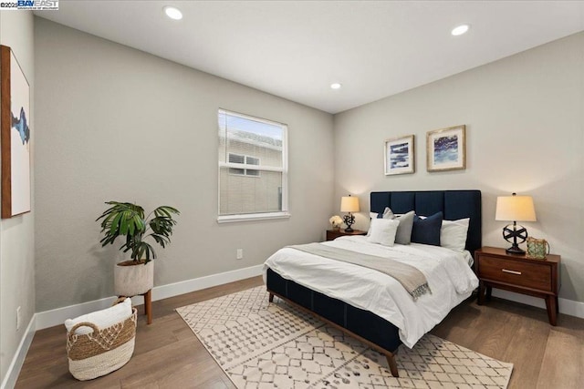 bedroom featuring hardwood / wood-style flooring