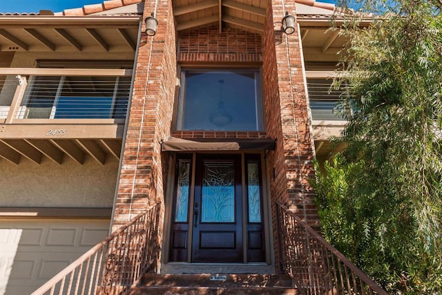 property entrance with a garage