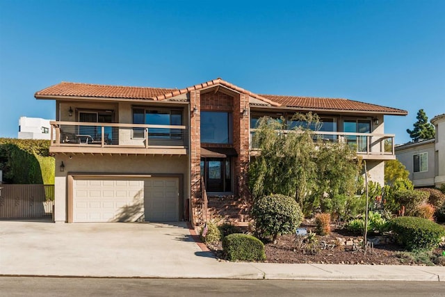 view of front of house with a balcony and a garage