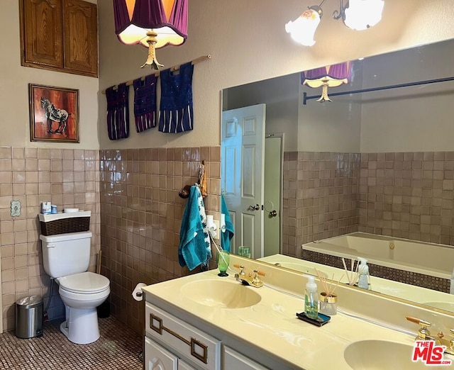 bathroom with tile walls, tile patterned flooring, and vanity