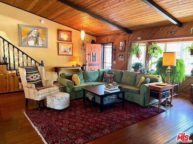 living room with wood ceiling, dark wood-type flooring, wooden walls, and vaulted ceiling with beams