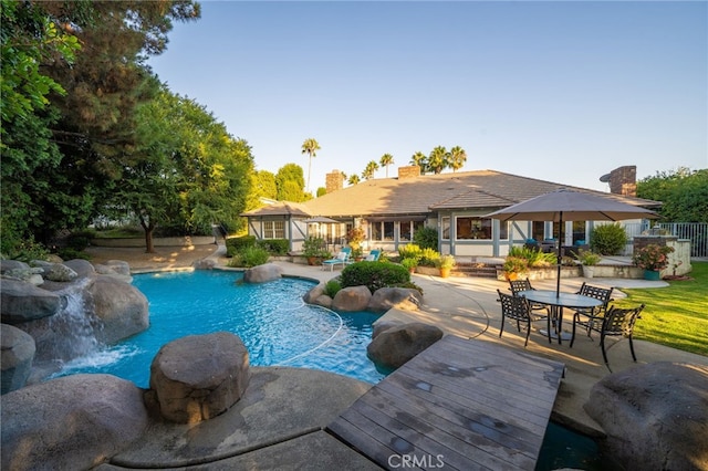 view of swimming pool with a patio