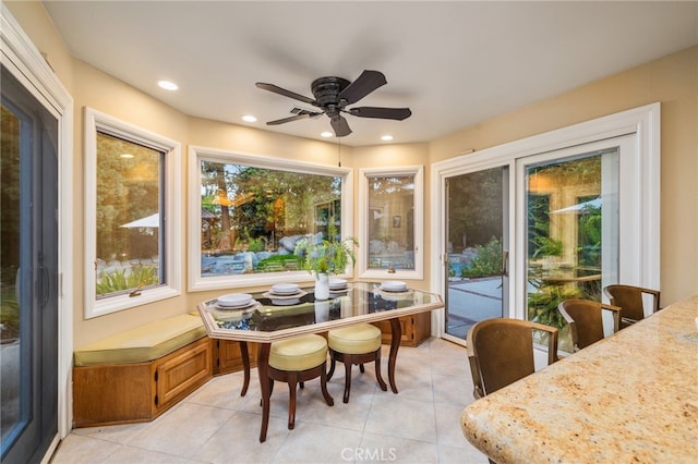 sunroom with ceiling fan