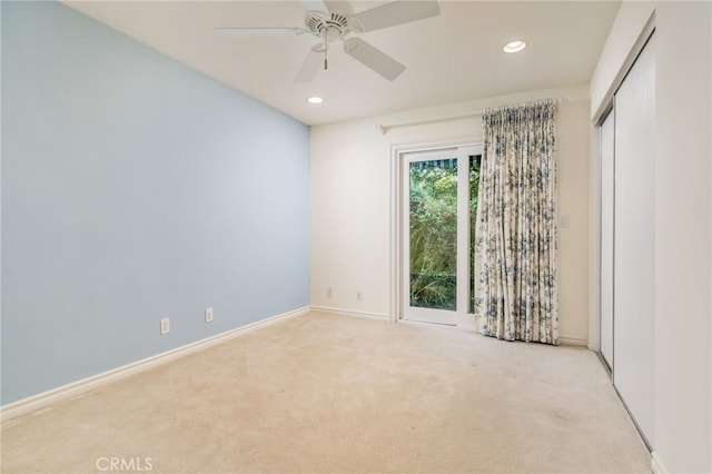 empty room with light carpet and ceiling fan