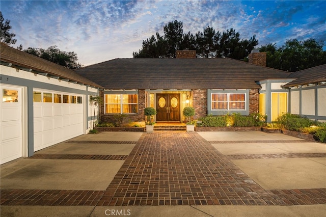 ranch-style home with a garage