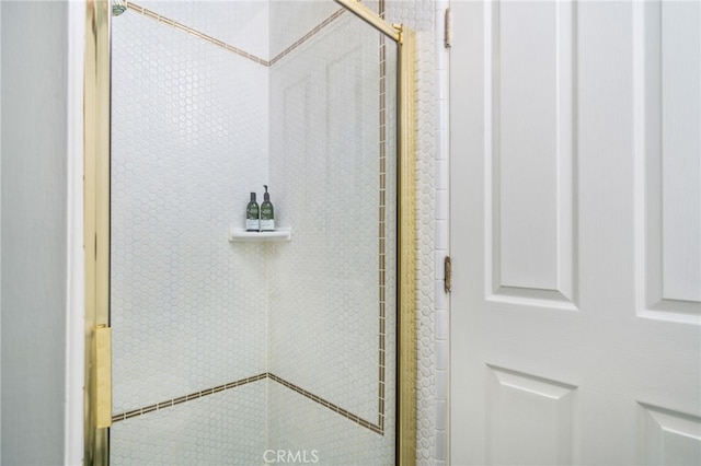 room details featuring a shower with shower door