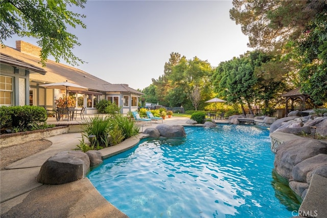 view of pool with a patio and a gazebo