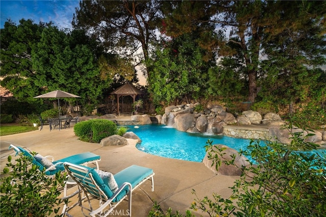 view of swimming pool featuring a gazebo, a patio, and pool water feature