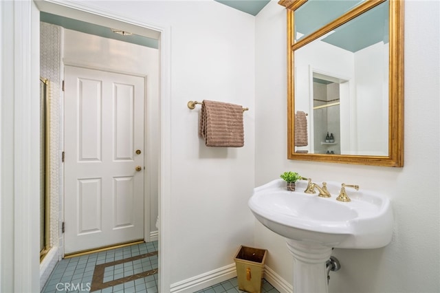 bathroom featuring tile patterned floors and walk in shower