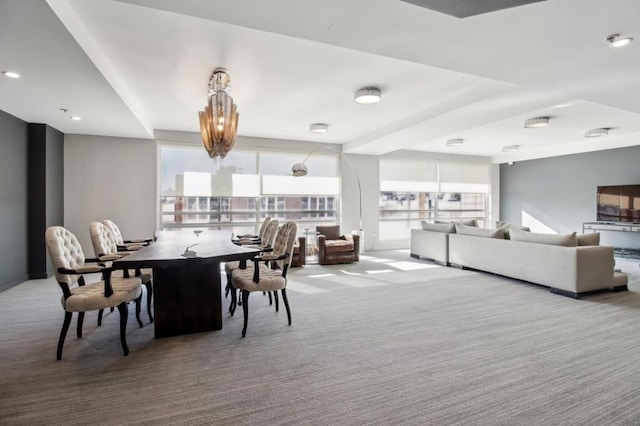 carpeted dining room with a healthy amount of sunlight