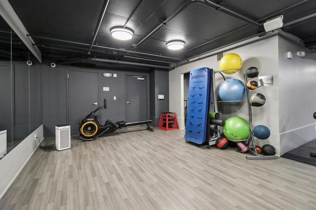 workout room featuring hardwood / wood-style floors