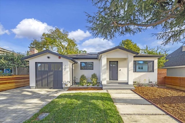 view of front of property with a garage