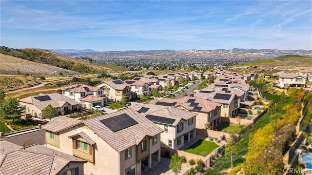 birds eye view of property with a mountain view