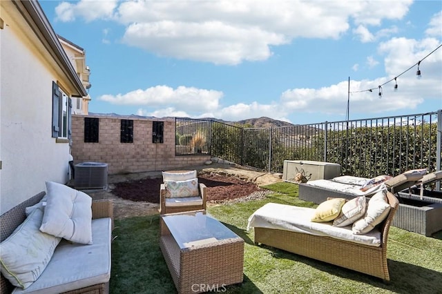 view of yard with an outdoor hangout area and central AC