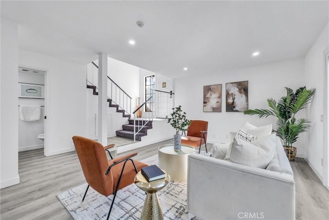 living room with light hardwood / wood-style flooring