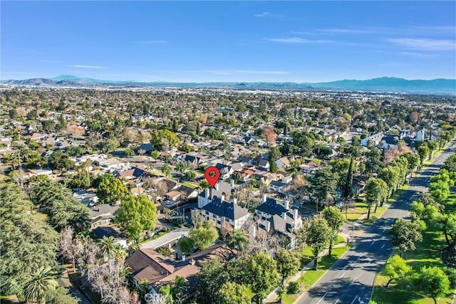 birds eye view of property with a mountain view