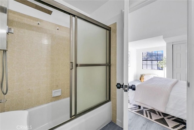 bathroom featuring shower / bath combination with glass door and hardwood / wood-style floors