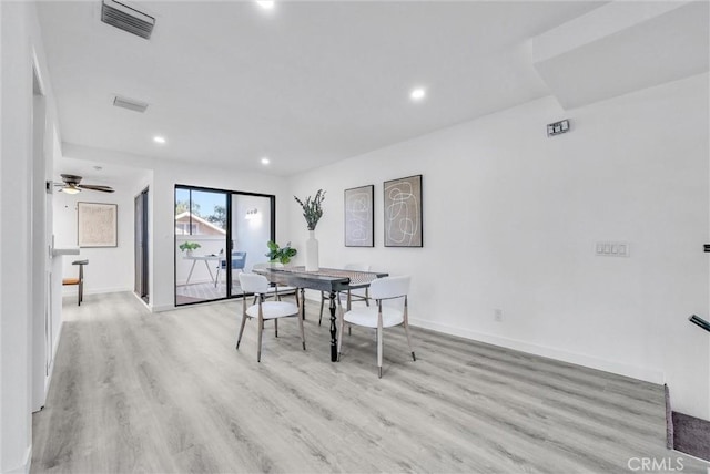 dining space featuring ceiling fan and light hardwood / wood-style flooring