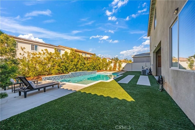 view of pool featuring a patio area, cooling unit, and a yard