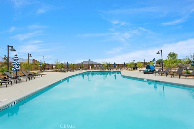 view of swimming pool with a patio area