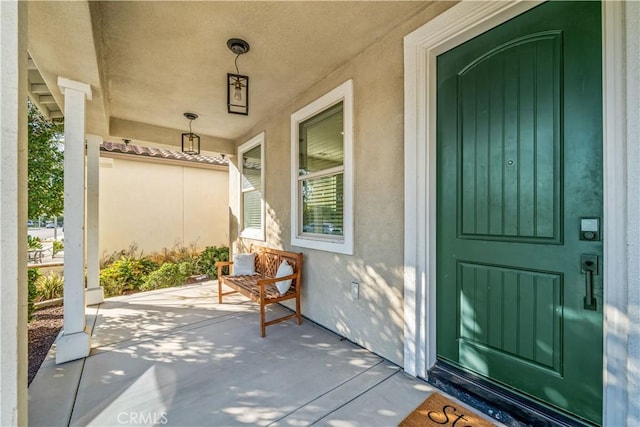 doorway to property with covered porch