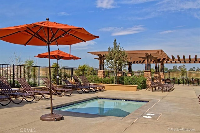 view of swimming pool featuring a pergola and a patio area