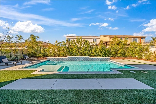 view of swimming pool with a lawn and a patio area