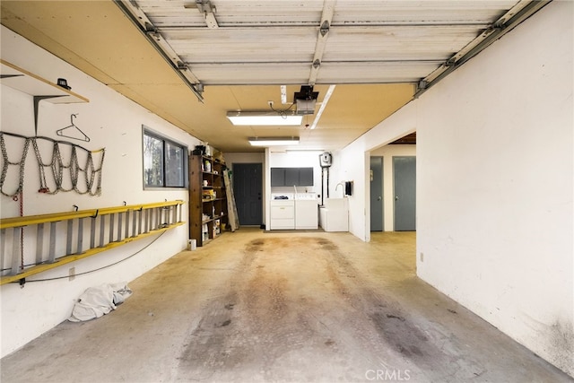 garage featuring washing machine and dryer