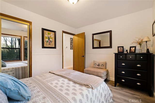 bedroom with hardwood / wood-style floors