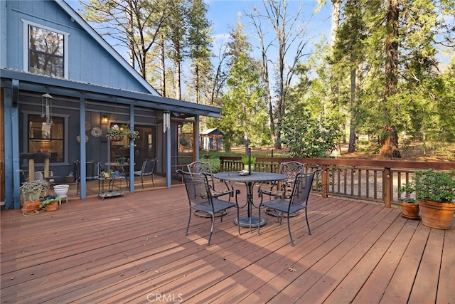 wooden terrace with a sunroom