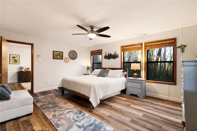 bedroom featuring ceiling fan and light wood-type flooring