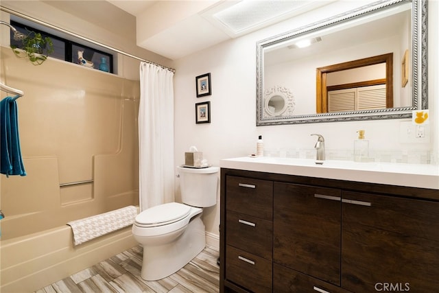 full bathroom with shower / tub combo with curtain, vanity, and toilet