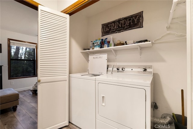 laundry room featuring washer and dryer and hardwood / wood-style floors