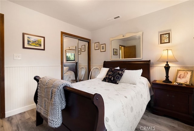 bedroom with a closet and wood-type flooring