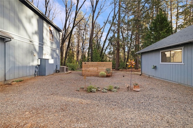 view of yard with central air condition unit