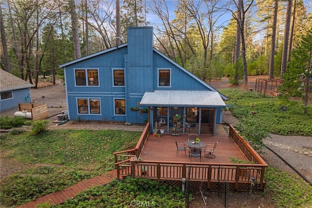 rear view of house with a deck