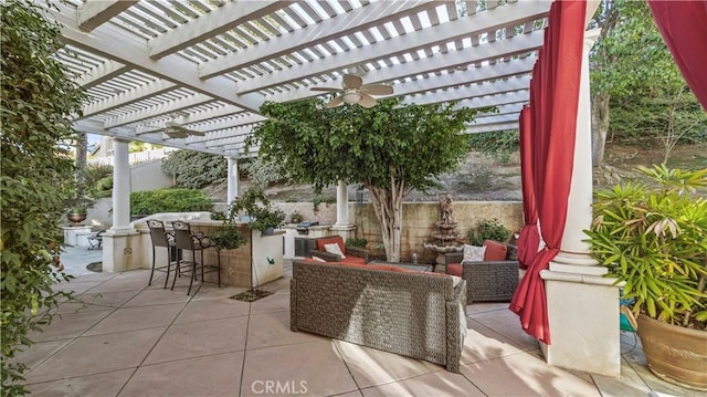 view of patio featuring a bar, a pergola, and an outdoor hangout area