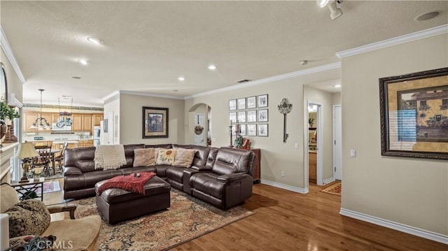 living room featuring ornamental molding and hardwood / wood-style flooring