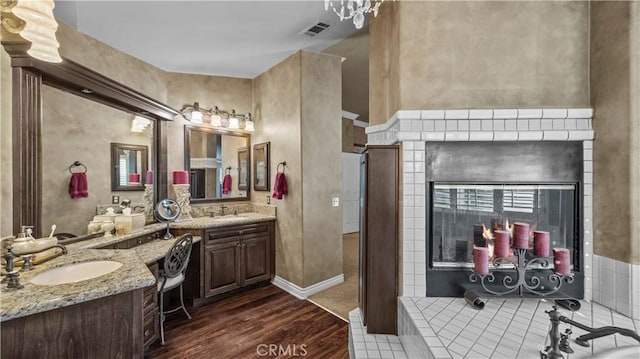 bathroom with vanity and hardwood / wood-style flooring