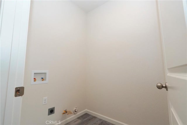 washroom with gas dryer hookup, wood-type flooring, hookup for a washing machine, and electric dryer hookup