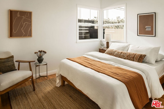 bedroom featuring wood-type flooring