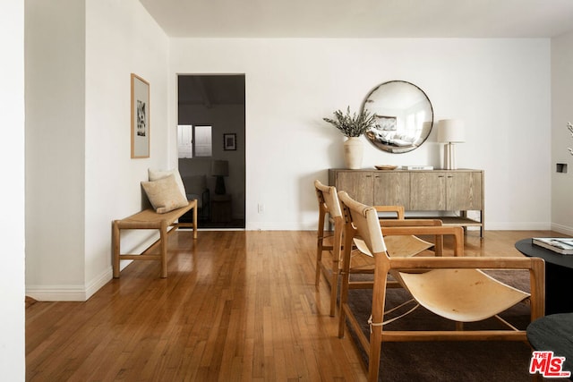 living area with hardwood / wood-style flooring