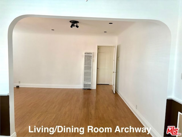 empty room featuring wood-type flooring