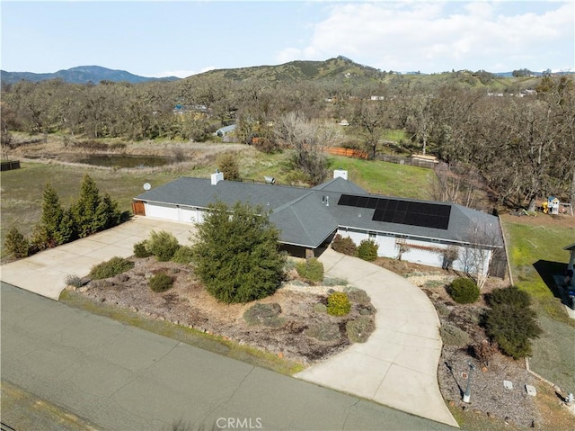 birds eye view of property featuring a mountain view