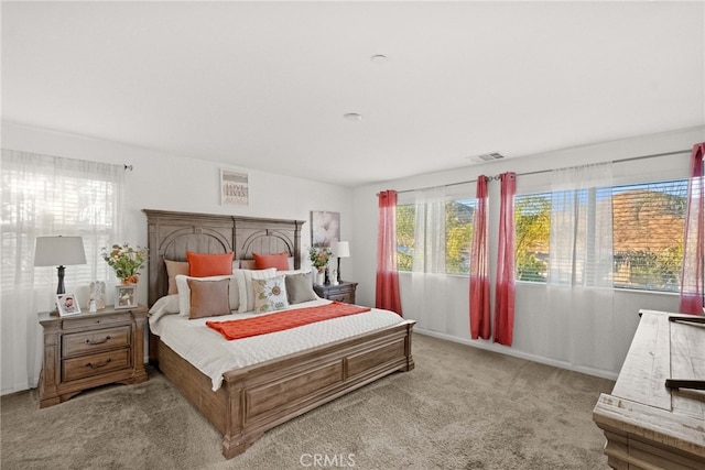 bedroom with light colored carpet